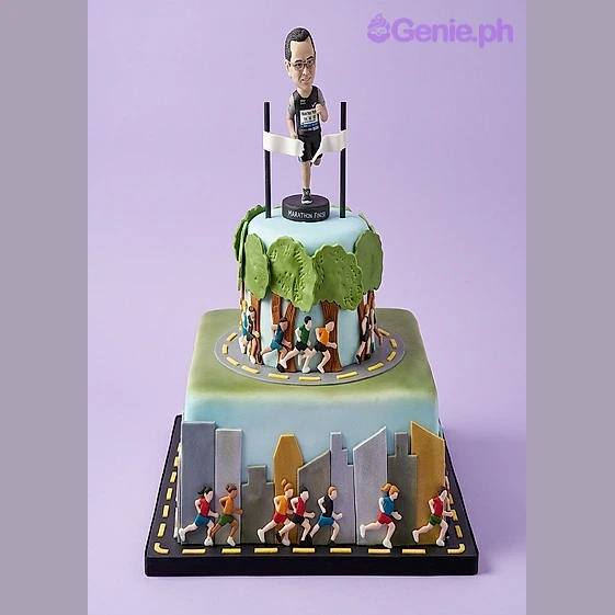 Runner 2-Tier Cake Light blue 2-tier fondant cake with a runner figurine topper, finish line banner, and printed runner cutouts on the sides.