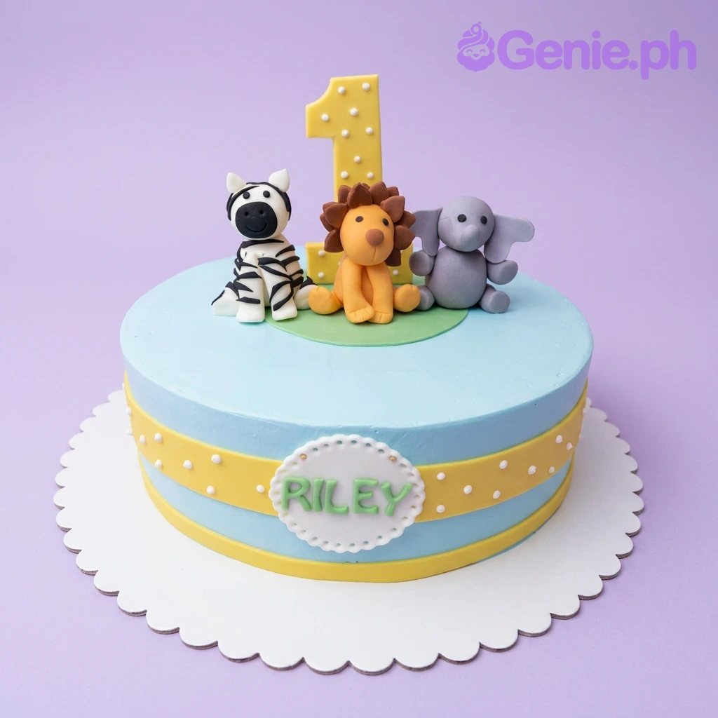 Safari First Birthday Sky Blue Cake A light blue 1-tier Safari First Birthday cake with fondant lion, zebra, purple elephant, yellow number one, and 'RILEY' text.