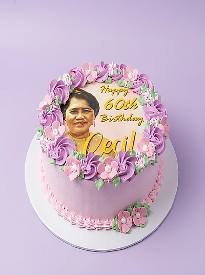 Senior Floral 1 Tier - colorful theme with edible photo of a woman and group of piped flowers and leaves on top border