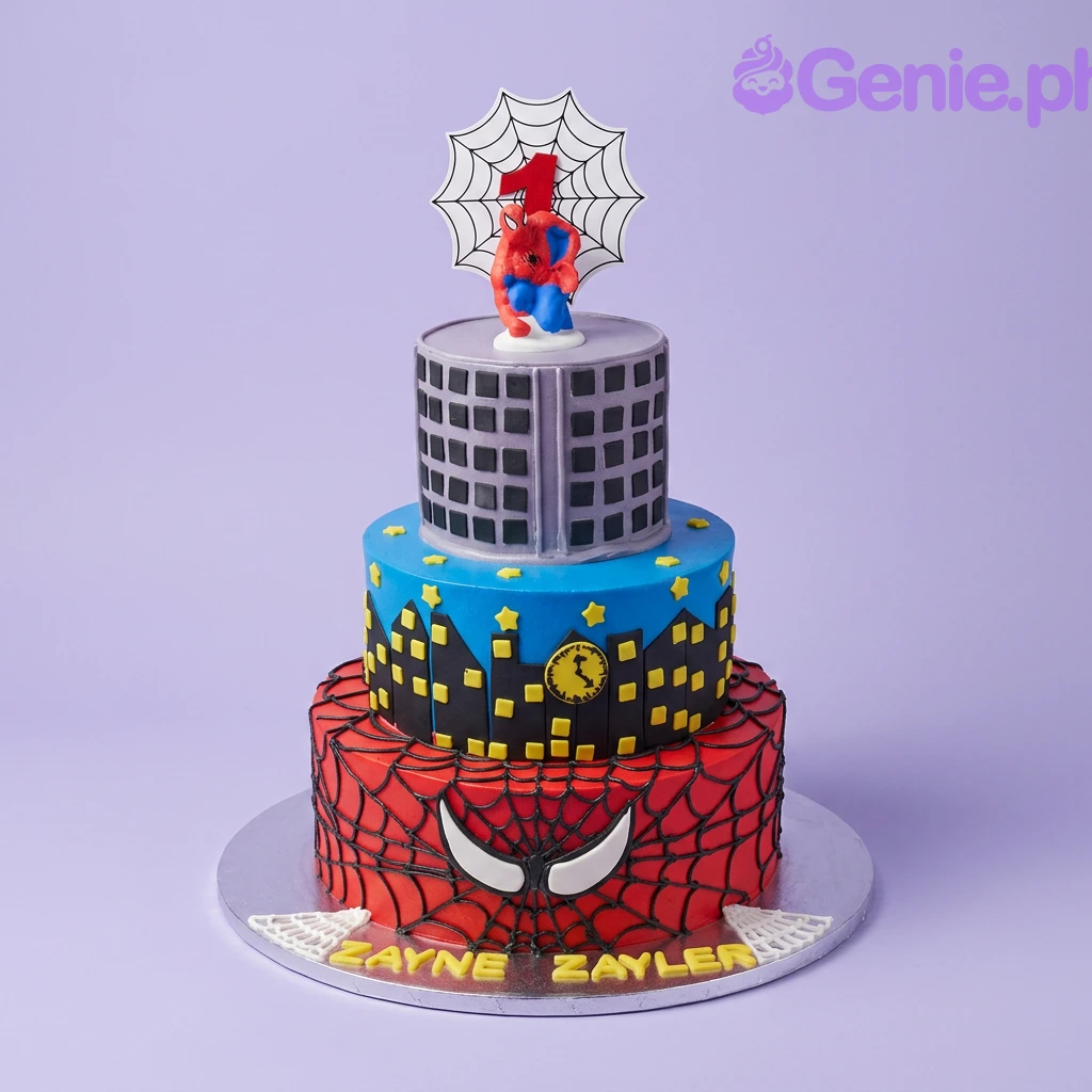 Spiderman-Inspired 3-Tier Birthday Cake A red, blue, and grey 3 Tier Fondant cake themed around Spiderman, featuring a Spiderman figure, red number one, web backdrop, city skyline, spider web patterns, and names ZAYNE and ZAYLER.