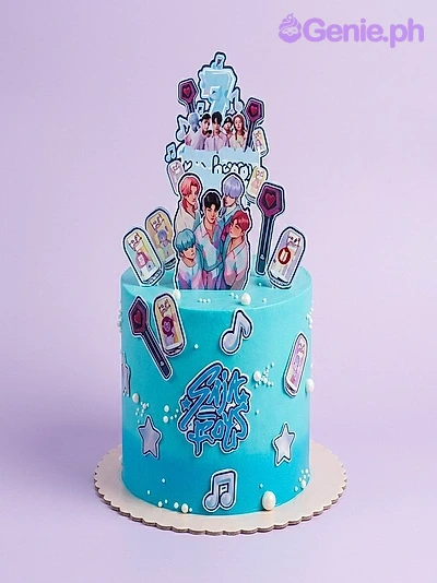 Stray Kids Kpop-Inspired Teal Birthday Cake A teal blue 1-tier cake themed around Stray Kids K-pop, featuring character printouts, lightstick graphics, music notes, and white sugar pearls.