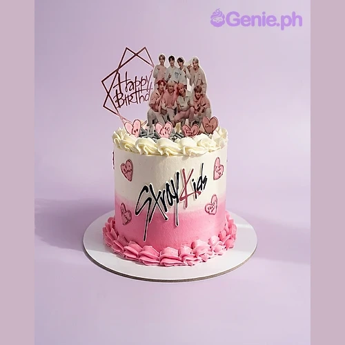 Stray Kids White Cake White one tier cake with Stray Kids members printout, gold Happy Birthday topper, Stray Kids logo, and piped pink hearts and border