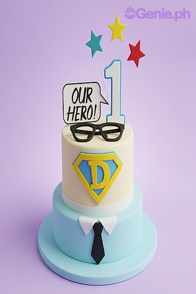 Superhero Birthday Ivory Cake Yellow fondant cake with superhero theme decorations including a number one printout and glasses topper