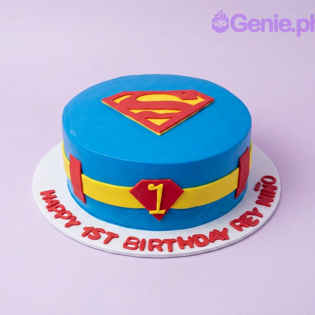 Superman-Inspired Blue Birthday Cake A blue, red, and yellow 1 Tier Fondant cake themed around Superman, featuring a Superman logo and a yellow belt design.