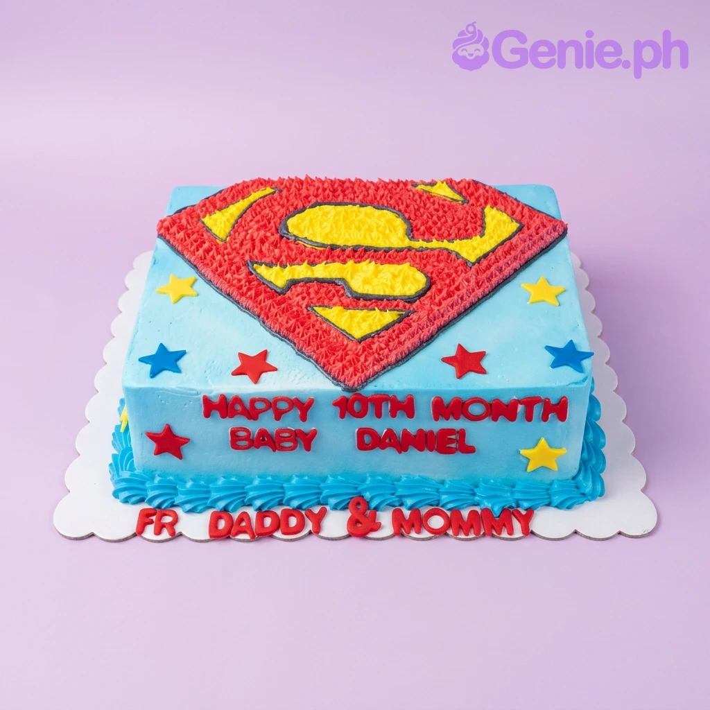 Superman-Inspired Sky Blue Rectangle Cake A blue, red, and yellow rectangle cake themed around Superman, featuring a Superman logo, stars, and red icing text.