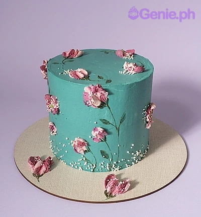 Teal Floral Birthday Cake A teal and white 1-tier cake themed around Teal Floral, featuring pink palette knife icing flowers and white pearl sprinkles at the base.