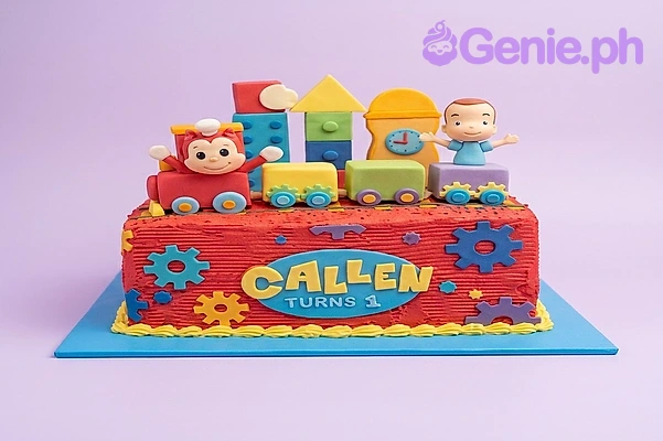 Train Birthday Red Rectangle Cake A red Rectangle cake themed around Train Birthday, featuring a colorful toy train topper and fondant gear decorations.