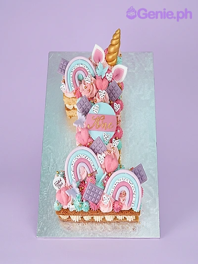 Unicorn Cake Number 1 shaped cake with unicorn horn, ears, and rainbow decorations