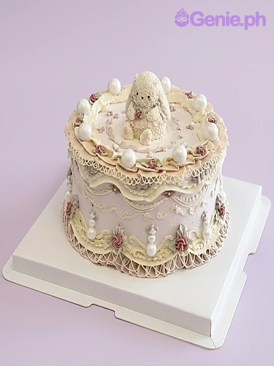 Vintage Bunny Lavender Birthday Cake A lavender 1-Tier cake themed around Vintage Bunny, featuring a 3D bunny topper, white icing ruffles, and white pearls.