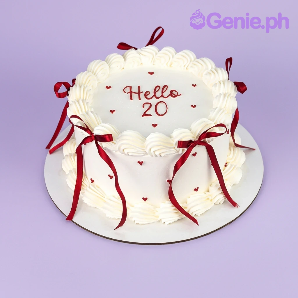 A white 1-tier cake themed around Vintage Minimalist, featuring red ribbon bows and a "Hello 20" message with red heart accents.