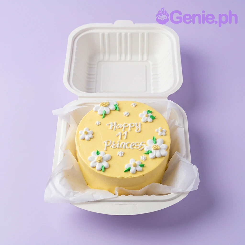 Yellow Daisy Floral Bento Birthday Cake A yellow and white bento cake themed with yellow daisies, featuring piped white icing daisies and 'Happy 11 Princess' text.