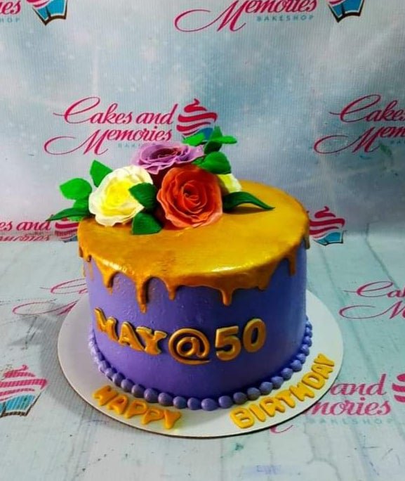 Purple 1-tier birthday cake with gold drip, edible roses, and gold gumpaste letters for a 50th birthday celebration. Purple 1-tier birthday cake with gold drip, edible roses, and gold gumpaste letters for a 50th birthday celebration.