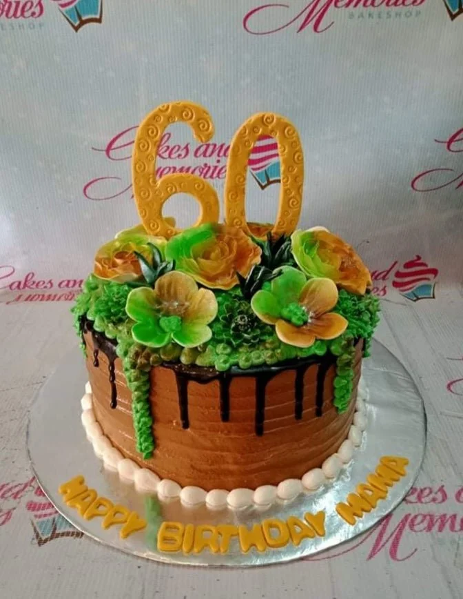 60th Birthday Teal Floral Cake A chocolate brown 1-tier 60th Birthday cake, featuring a large gold '60' topper, green succulents, yellow flowers, and a white pearl border.
