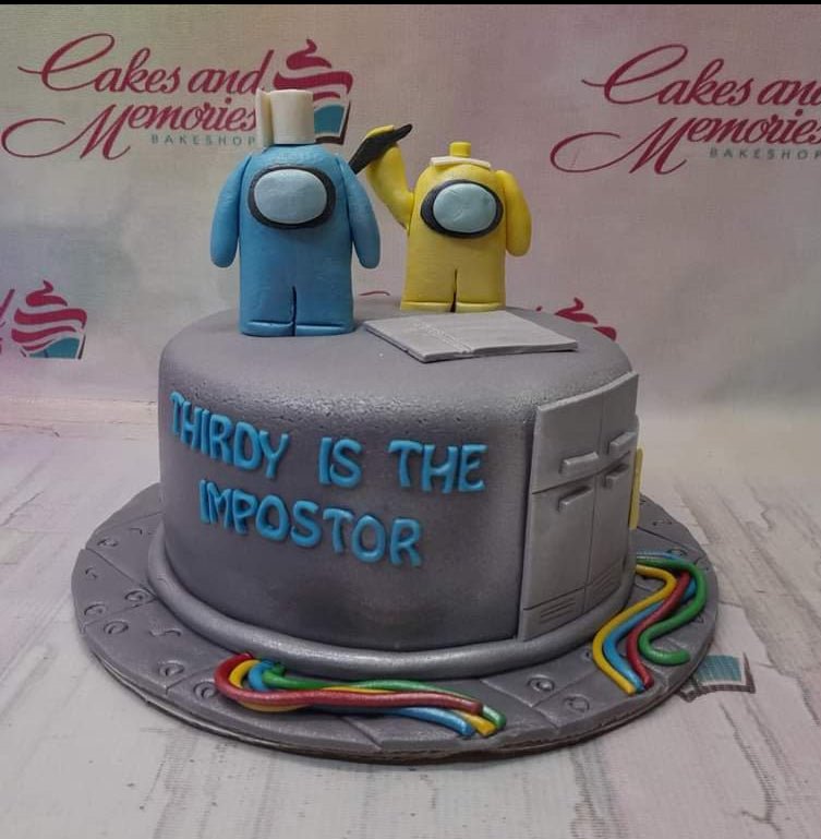 Gray Among Us themed fondant cake with blue and yellow character toppers and colorful wire decorations. Gray Among Us themed fondant cake with blue and yellow character toppers and colorful wire decorations.