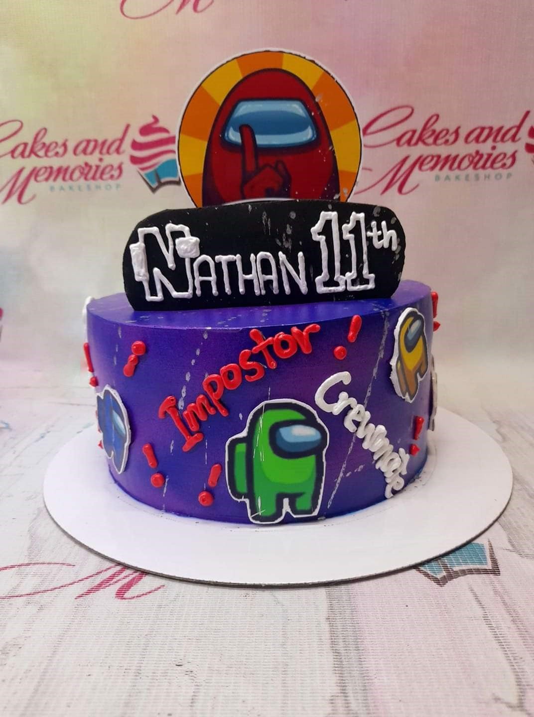 Purple Among Us themed birthday cake for Nathan's 11th birthday with character printouts and red icing accents. Purple Among Us themed birthday cake for Nathan's 11th birthday with character printouts and red icing accents.