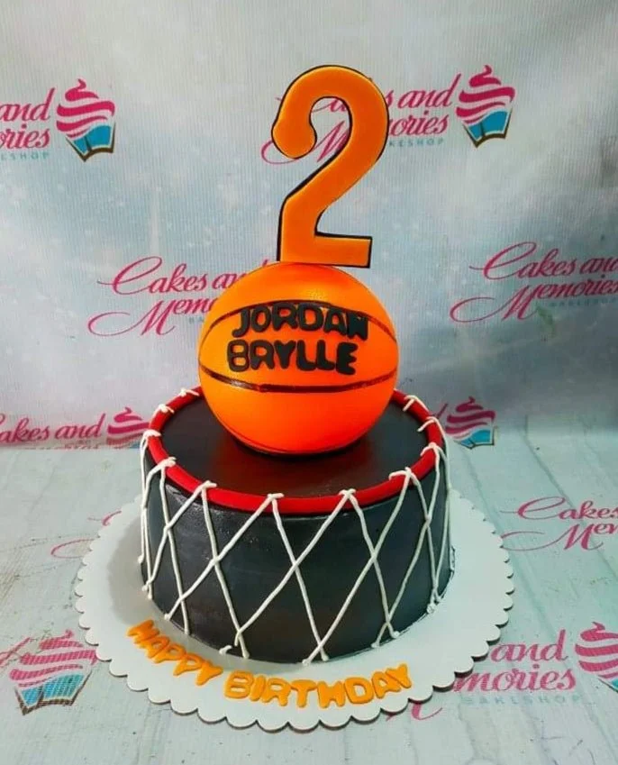 Basketball Black Birthday Cake Black basketball themed birthday cake with a large orange basketball topper and a number 2 on top.