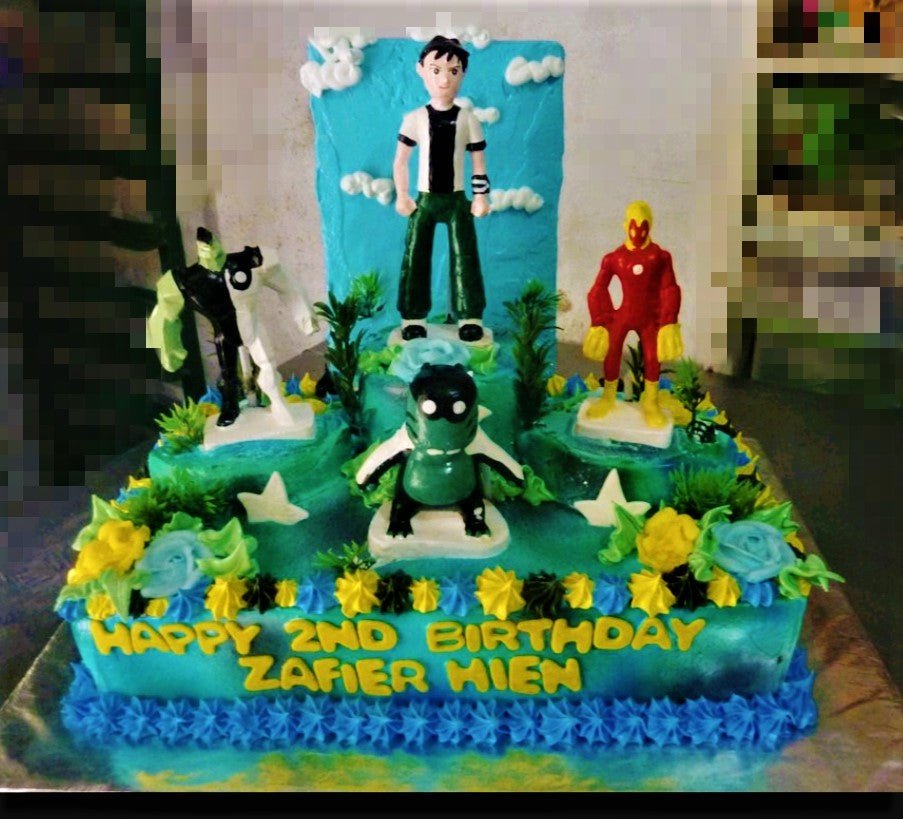 Ben 10 themed square cake with 3D character figures, blue icing, and yellow birthday message. Ben 10 themed square cake with 3D character figures, blue icing, and yellow birthday message.