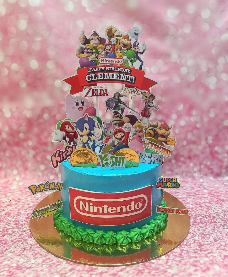 blue Nintendo 1 Tier - blue, gold theme with printout of various Nintendo characters and logos and gold coin edible decora... blue Nintendo 1 Tier - blue, gold theme with printout of various Nintendo characters and logos and gold coin edible decora...