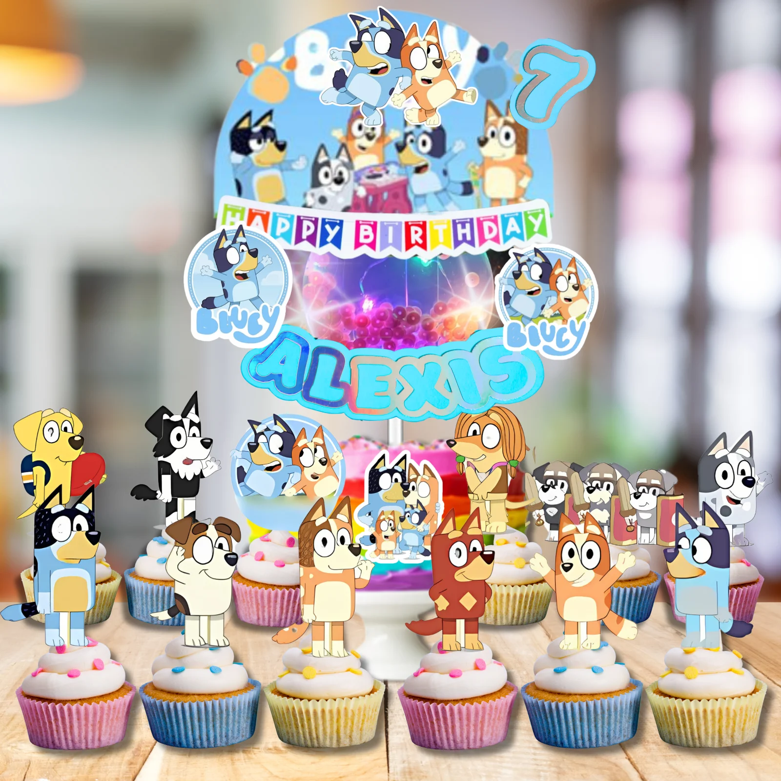 Bluey themed birthday cake with a large character backdrop, name topper, and matching cupcakes featuring various characters from the show. Bluey themed birthday cake with a large character backdrop, name topper, and matching cupcakes featuring various characters from the show.