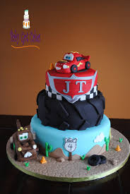Cars Disney 3 Tier Fondant - red, black, blue theme with Lightning McQueen car and tire tread texture Cars Disney 3 Tier Fondant - red, black, blue theme with Lightning McQueen car and tire tread texture