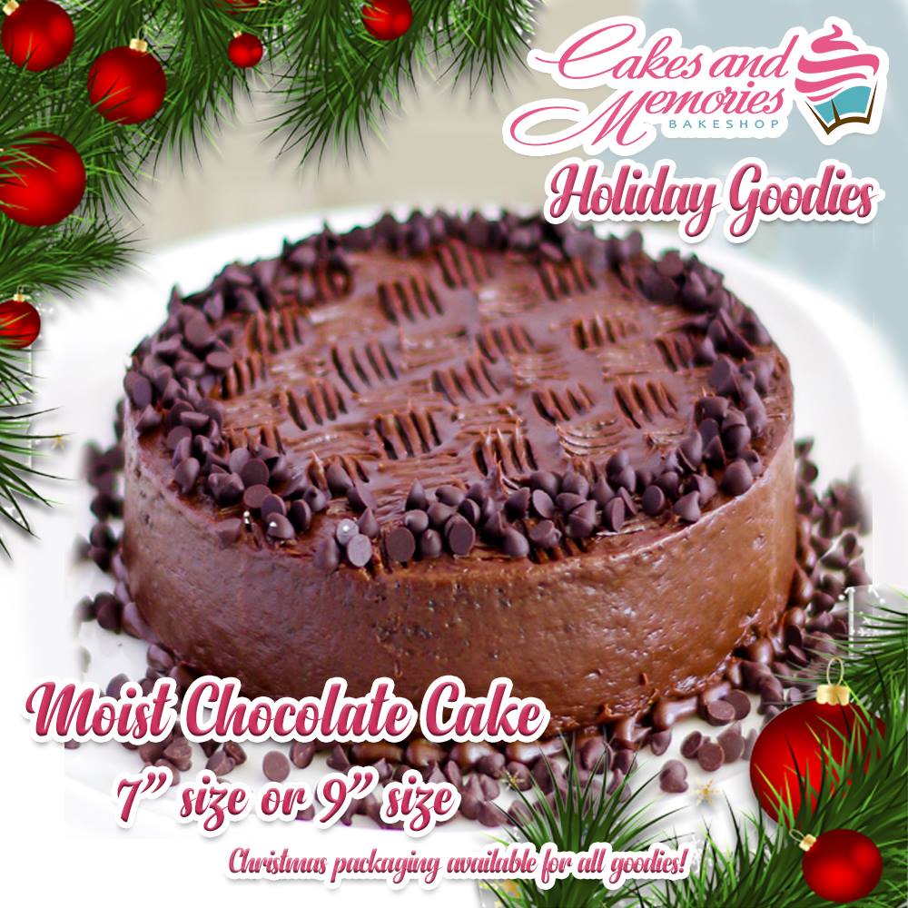 Moist chocolate cake topped with chocolate chips and decorative chocolate icing swirls. Moist chocolate cake topped with chocolate chips and decorative chocolate icing swirls.