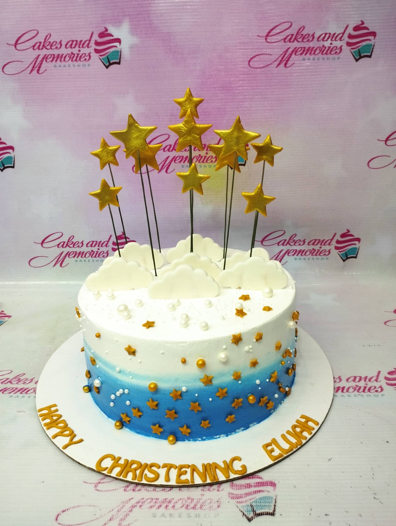 Blue and white gradient christening cake with gold stars and white fondant clouds Blue and white gradient christening cake with gold stars and white fondant clouds