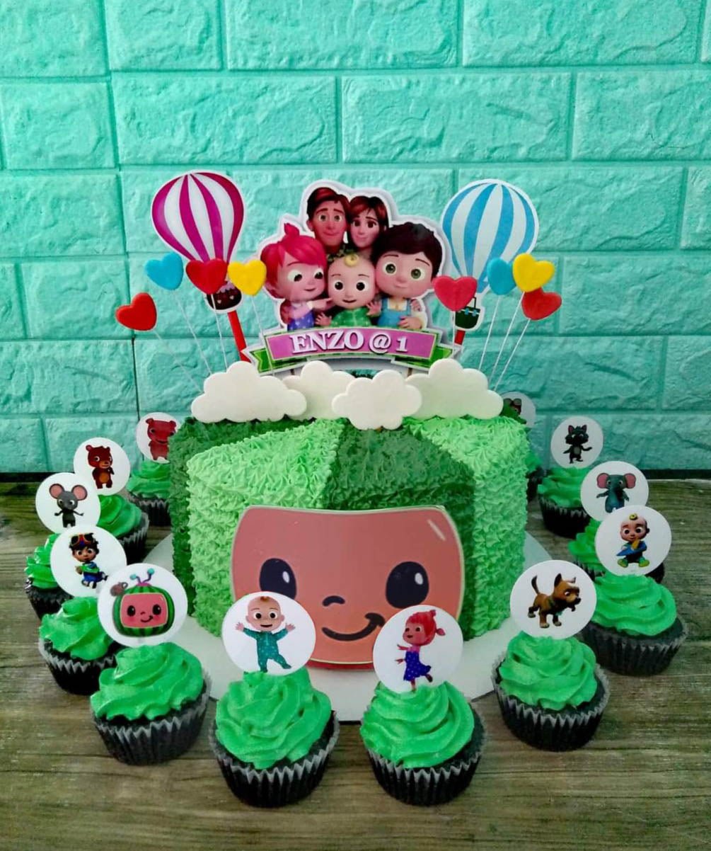 Green Cocomelon themed birthday cake with textured icing, character printouts, and matching cupcakes. Green Cocomelon themed birthday cake with textured icing, character printouts, and matching cupcakes.