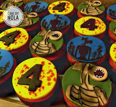 A white 1 Tier cake featuring the number '4' in black icing on the top. A white 1 Tier cake featuring the number '4' in black icing on the top.