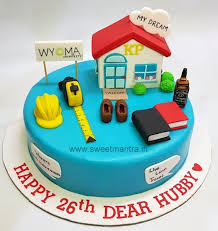 Blue fondant cake with a 3D house topper, yellow hard hat, tape measure, and books Blue fondant cake with a 3D house topper, yellow hard hat, tape measure, and books
