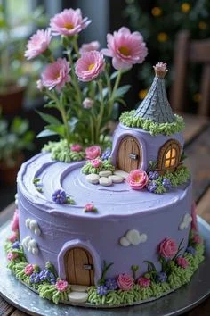 Purple fairy house cake with a small cottage topper, pink gumpaste flowers, and green icing grass on a single tier. Purple fairy house cake with a small cottage topper, pink gumpaste flowers, and green icing grass on a single tier.