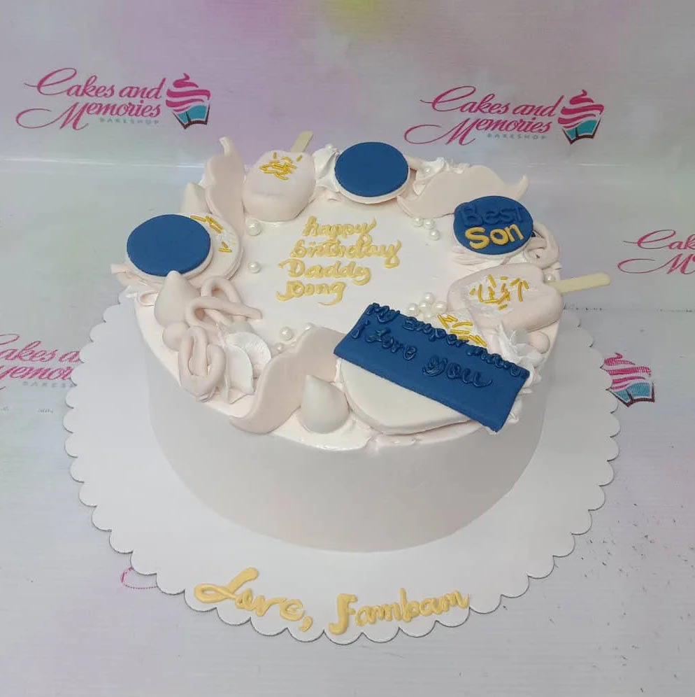 Father Birthday White Cake White minimalist birthday cake for a father with blue and white fondant decorations including popsicles, mustaches, and pearls.