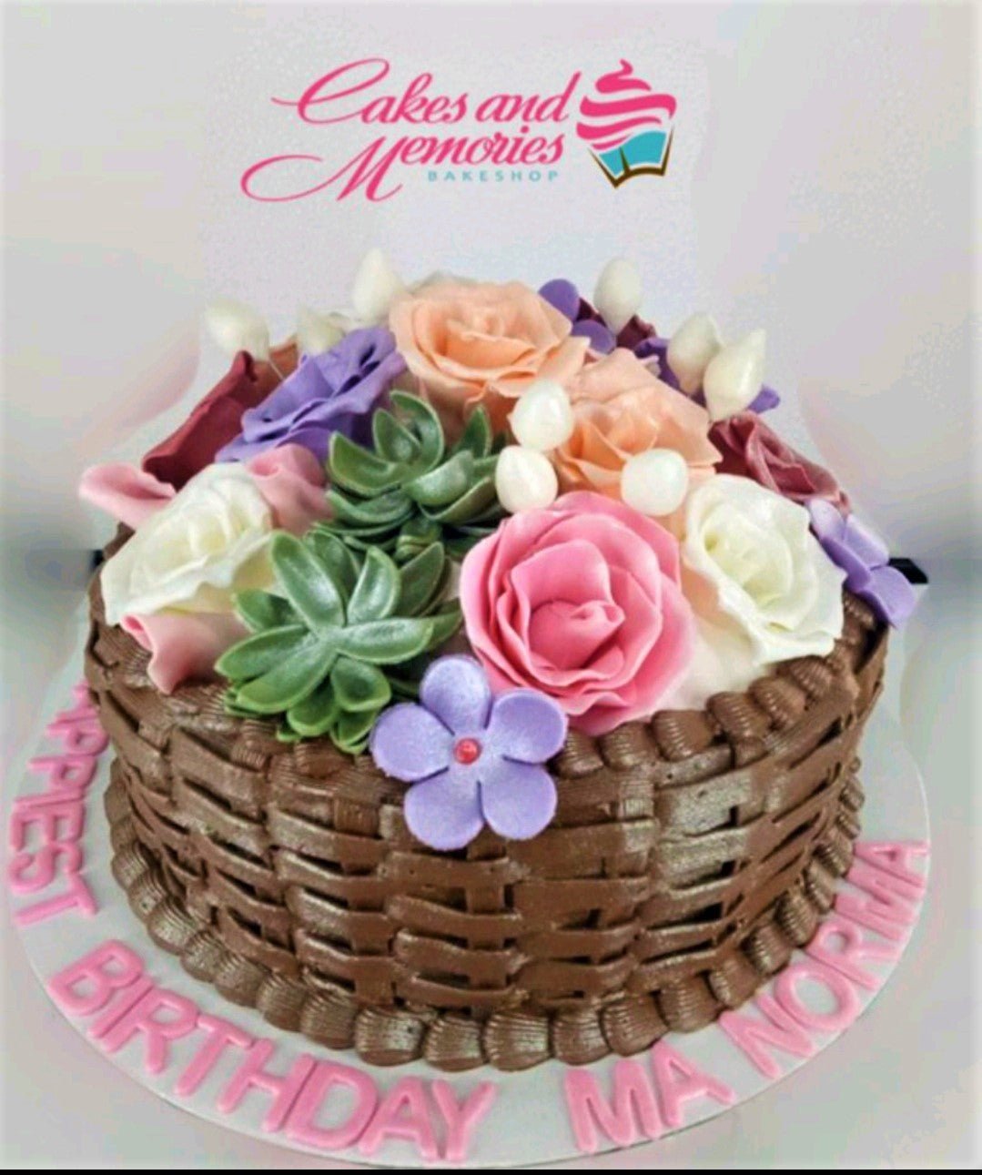 Basket weave chocolate cake topped with a colorful bouquet of edible fondant roses and succulents. Basket weave chocolate cake topped with a colorful bouquet of edible fondant roses and succulents.