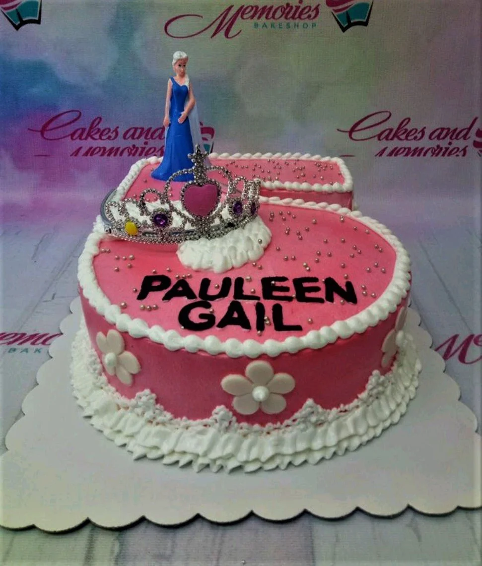 Pink number 5 shaped cake with Elsa figurine, silver tiara, and white icing flowers for Pauleen Gail's birthday.