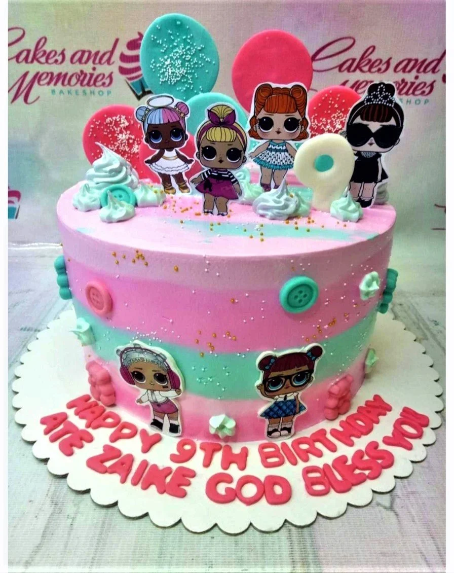 Pink and teal LOL Surprise themed birthday cake with character printouts, fondant buttons, and a white number 9 topper.