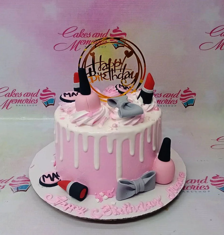 Makeup Pink Drip Birthday Cake A pink and white 1-Tier makeup cake, featuring a gold Happy Birthday topper, pink nail polish, red lipsticks, and white drip.