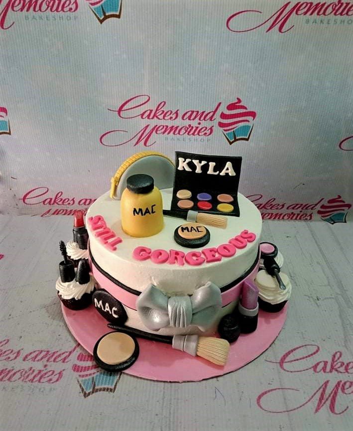 White 1-tier makeup themed birthday cake with pink accents and fondant cosmetics White 1-tier makeup themed birthday cake with pink accents and fondant cosmetics