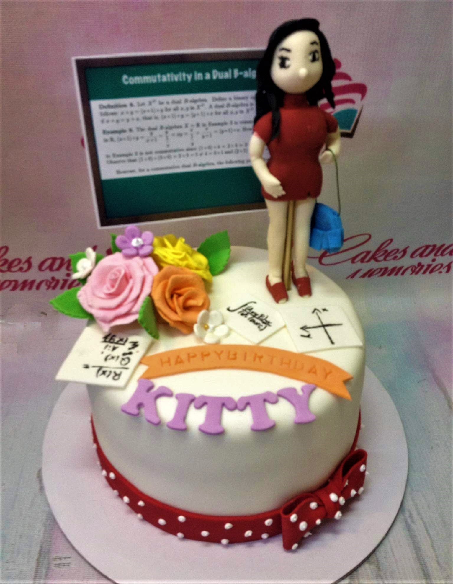 White fondant cake with a custom 3D female figure, math-themed toppers, and colorful gumpaste roses. White fondant cake with a custom 3D female figure, math-themed toppers, and colorful gumpaste roses.