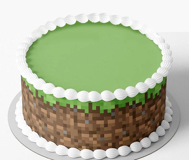 Minecraft-Inspired Mint Cake A green and brown 1-tier cake themed around Minecraft, featuring a pixelated dirt side wrap and white piped borders.