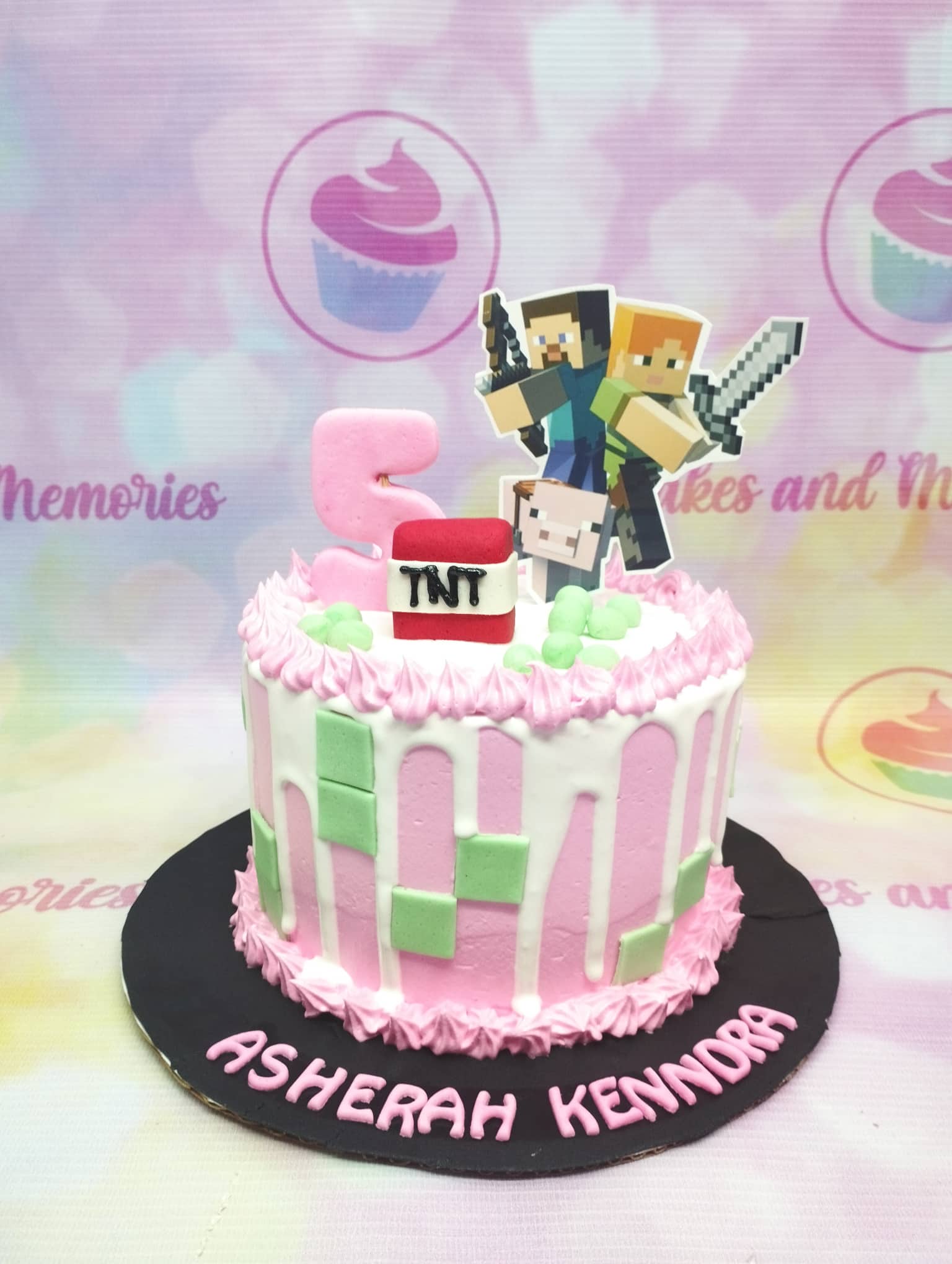 Pink Minecraft themed birthday cake with white drip, green pixel squares, and character toppers for Asherah Kenndra's 5th birthday. Pink Minecraft themed birthday cake with white drip, green pixel squares, and character toppers for Asherah Kenndra's 5th birthday.