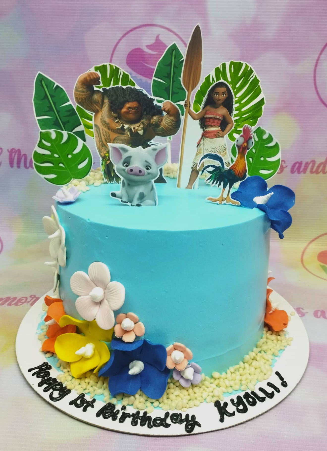 Light blue Moana themed birthday cake with Maui, Moana, Pua, and Hei Hei printout toppers and colorful gumpaste flowers. Light blue Moana themed birthday cake with Maui, Moana, Pua, and Hei Hei printout toppers and colorful gumpaste flowers.