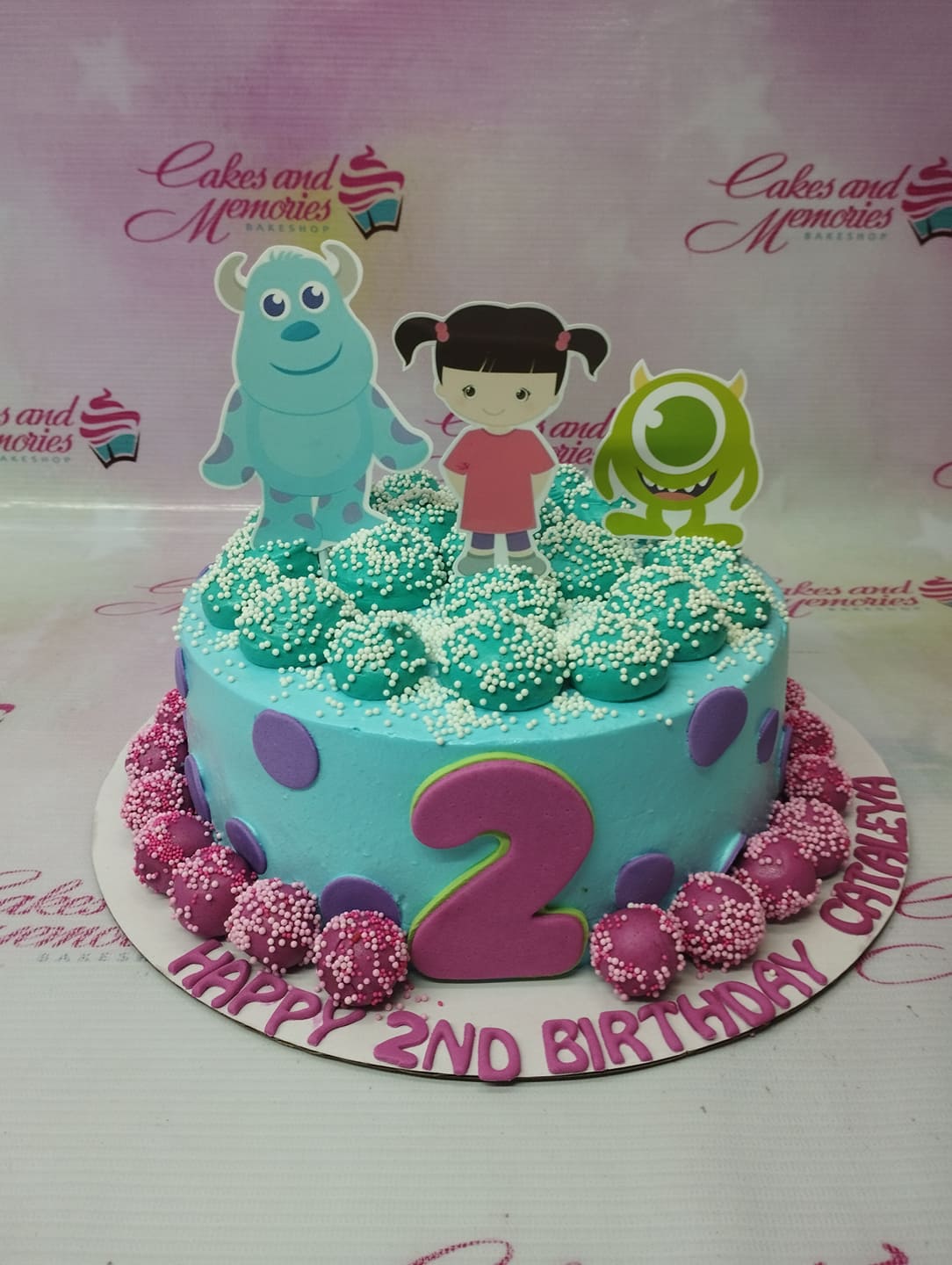 Monsters Inc themed light blue cake with Sulley, Mike Wazowski, and Boo printout toppers and purple fondant dots. Monsters Inc themed light blue cake with Sulley, Mike Wazowski, and Boo printout toppers and purple fondant dots.