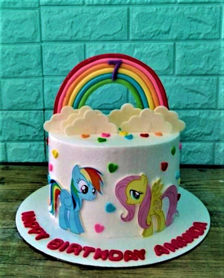 Little Pony Cake - 1108 White My Little Pony birthday cake with a rainbow topper, clouds, and colorful heart sprinkles.
