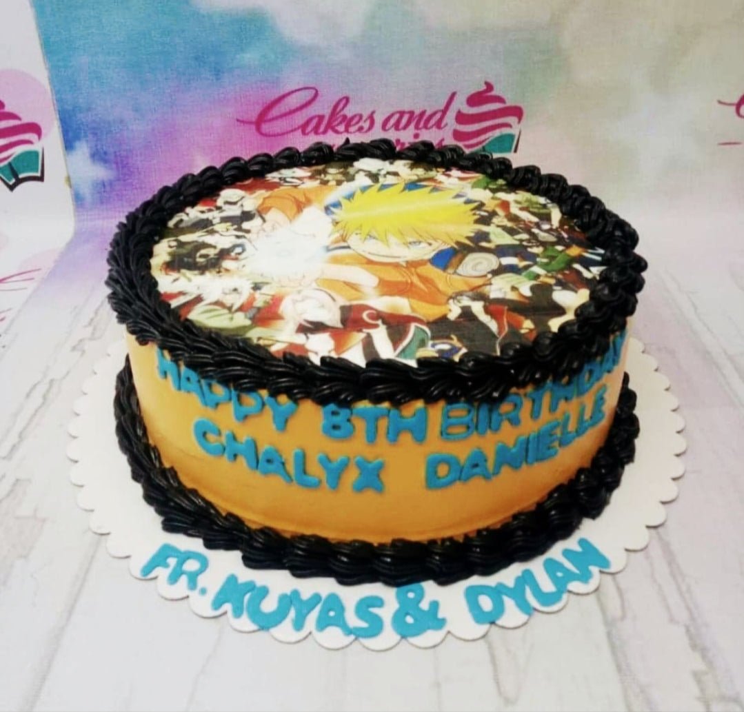 Naruto themed birthday cake with orange icing, black piped borders, and a large character printout on top. Naruto themed birthday cake with orange icing, black piped borders, and a large character printout on top.