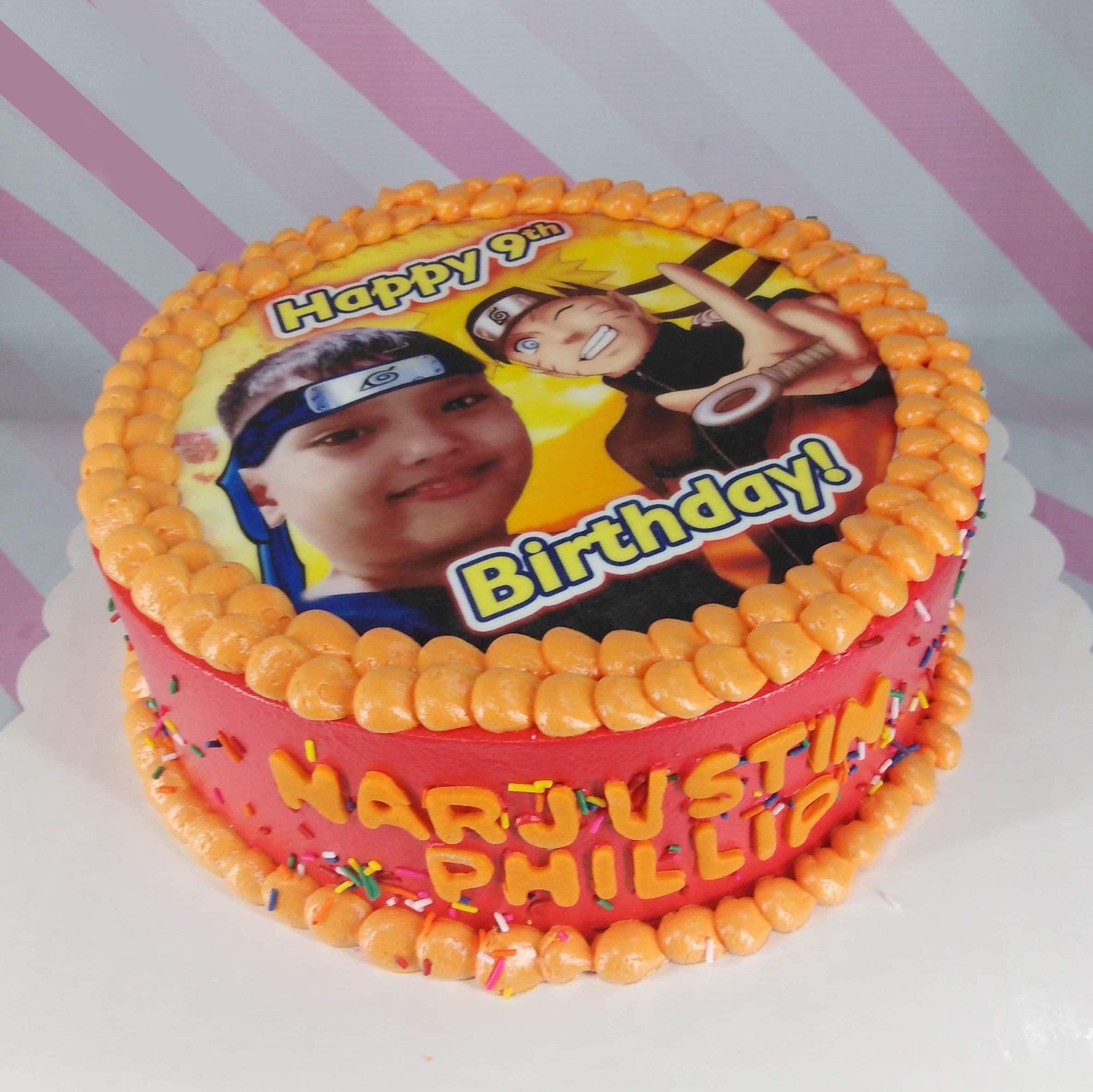 Naruto themed birthday cake with a custom photo printout, orange icing borders, and colorful sprinkles on a red base. Naruto themed birthday cake with a custom photo printout, orange icing borders, and colorful sprinkles on a red base.
