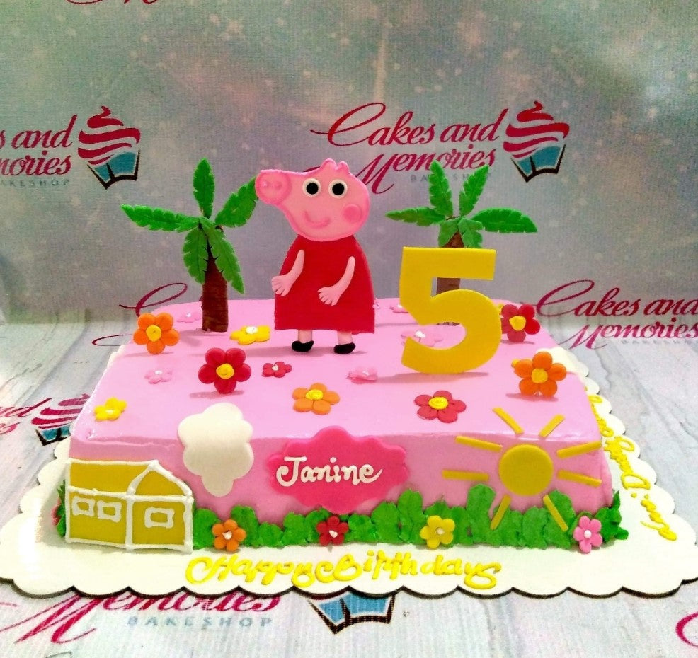 Pink Peppa Pig rectangle birthday cake with fondant flowers, palm trees, and a yellow number five topper. Pink Peppa Pig rectangle birthday cake with fondant flowers, palm trees, and a yellow number five topper.