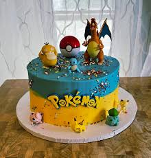 A multicolor 1 tier cake featuring Charizard, Pikachu, Squirtle, Bulbasaur, Psyduck, Jigglypuff, Meowth, a Pokeball, and a Pokemon logo printout, decorated with multi-colored sprinkles. A multicolor 1 tier cake featuring Charizard, Pikachu, Squirtle, Bulbasaur, Psyduck, Jigglypuff, Meowth, a Pokeball, and a Pokemon logo printout, decorated with multi-colored sprinkles.