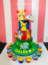 A multicolor 3 Tier cake featuring a Dragonite figure, an Ash Ketchum hat, Pikachu, Squirtle, Charmander and Bulbasaur printouts, gumpaste letters, fondant stars and lightning bolts. A multicolor 3 Tier cake featuring a Dragonite figure, an Ash Ketchum hat, Pikachu, Squirtle, Charmander and Bulbasaur printouts, gumpaste letters, fondant stars and lightning bolts.