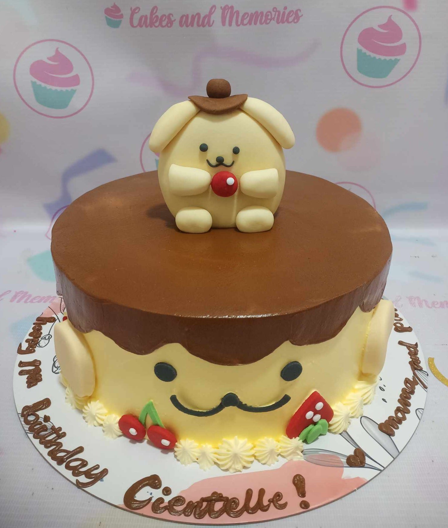 Pompompurin themed yellow cake with brown chocolate drip icing and a 3D fondant Pompompurin figure on top. Pompompurin themed yellow cake with brown chocolate drip icing and a 3D fondant Pompompurin figure on top.