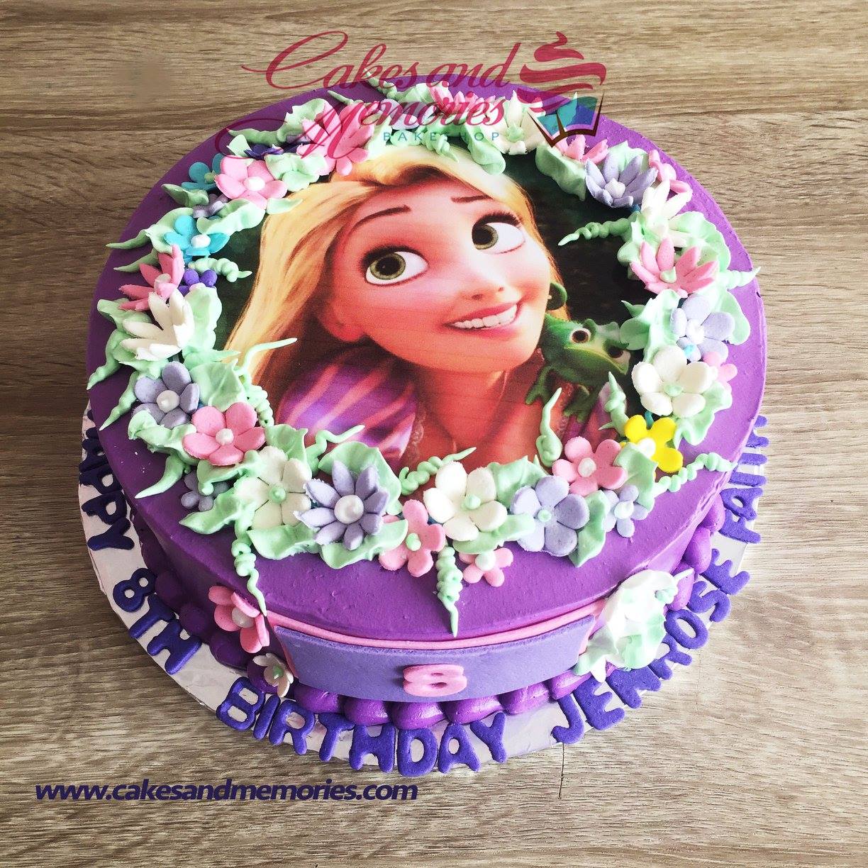 Purple Rapunzel themed birthday cake with edible photo print and colorful gumpaste flowers
