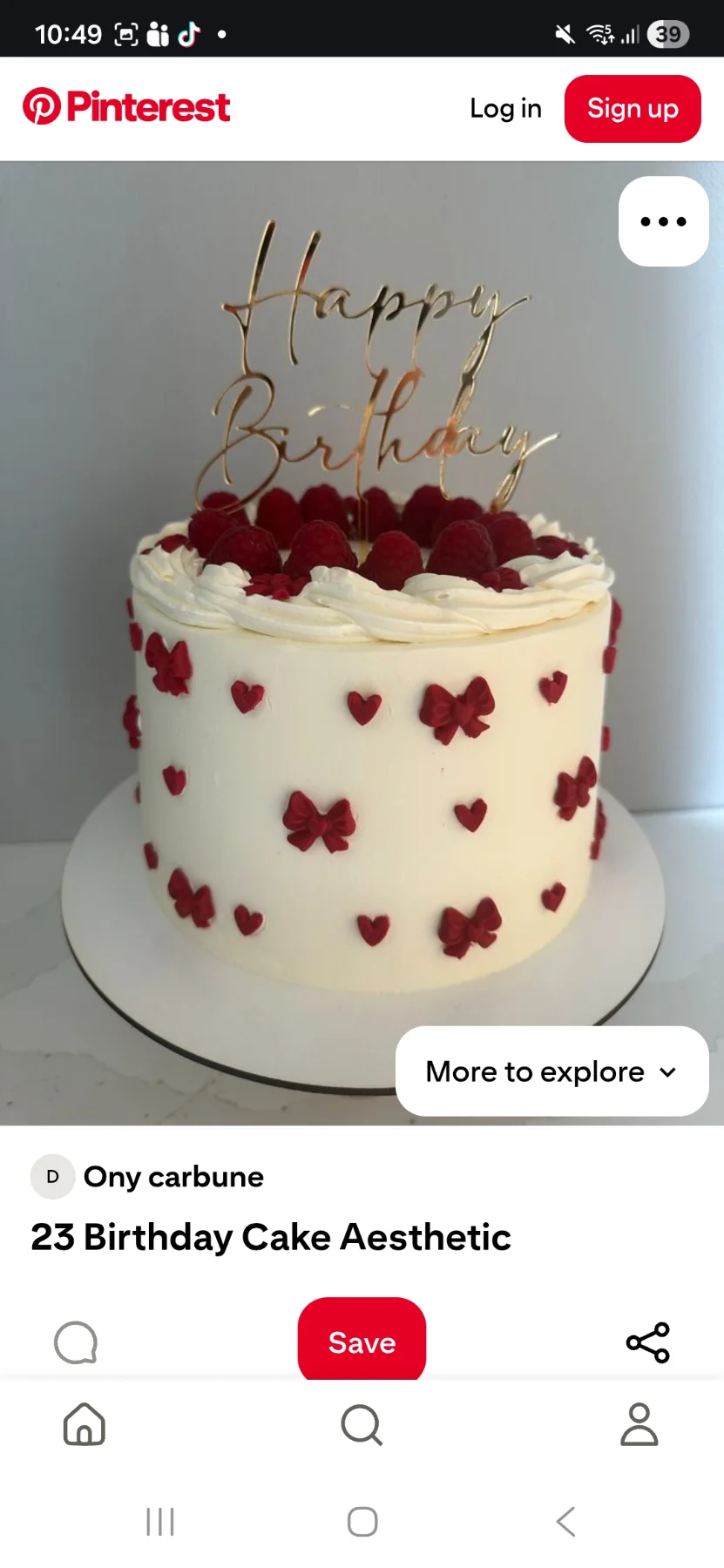 White buttercream cake decorated with fresh raspberries on top and small red fondant bows and hearts on the sides. White buttercream cake decorated with fresh raspberries on top and small red fondant bows and hearts on the sides.